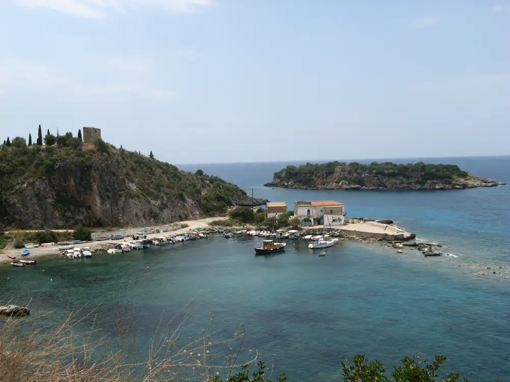 Kardamyli village with traditional stone architecture overlooking the sea and dramatic Taygetos mountain coastline